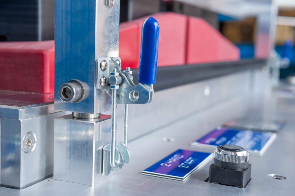 Toggle clamp in use alongside retractable locators