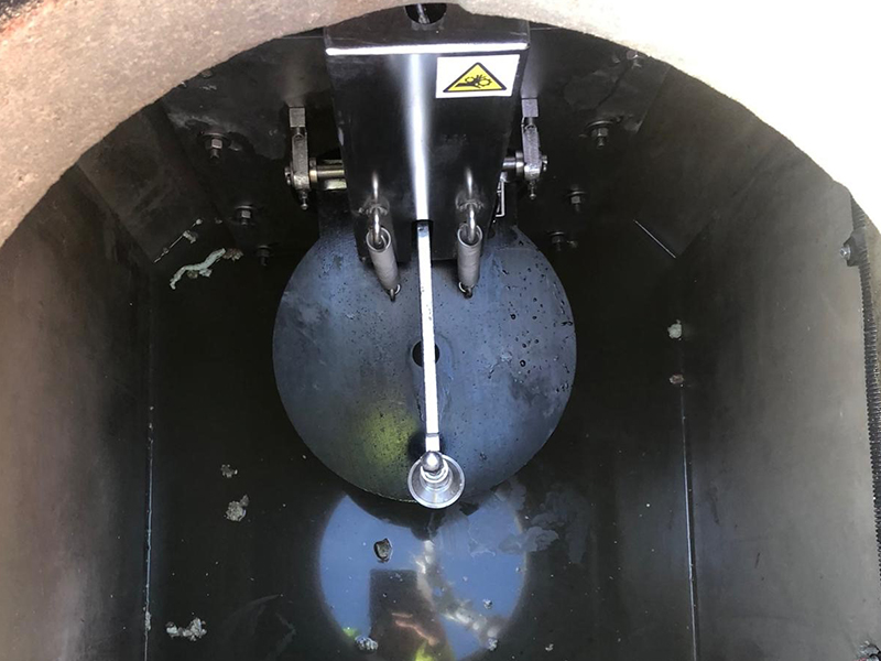 Pollution containment devices manufactured by Sandfield Engineering a tank embedded in the ground.