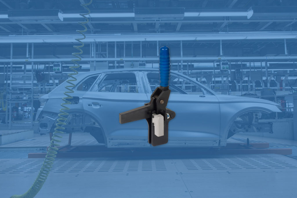 A view of a Solenoid bolt locking toggle clamp for Ford and their automotive manufacturing process.