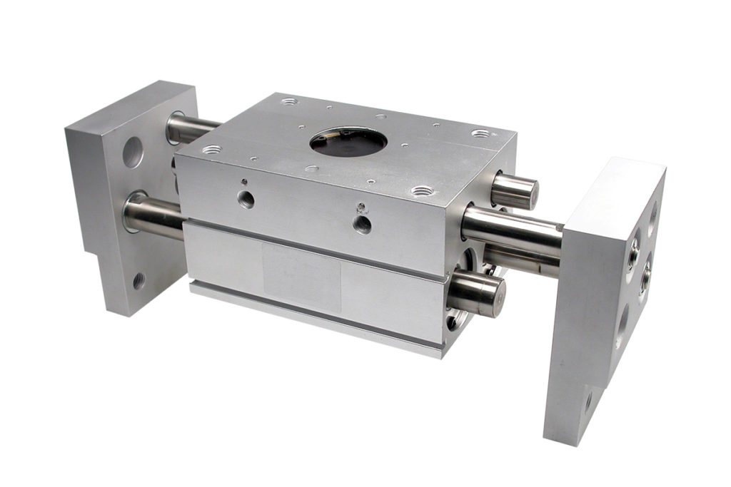 A large block with two moving plates attached to a central block, pneumatically powered, sandfield Engineering product- SGSX