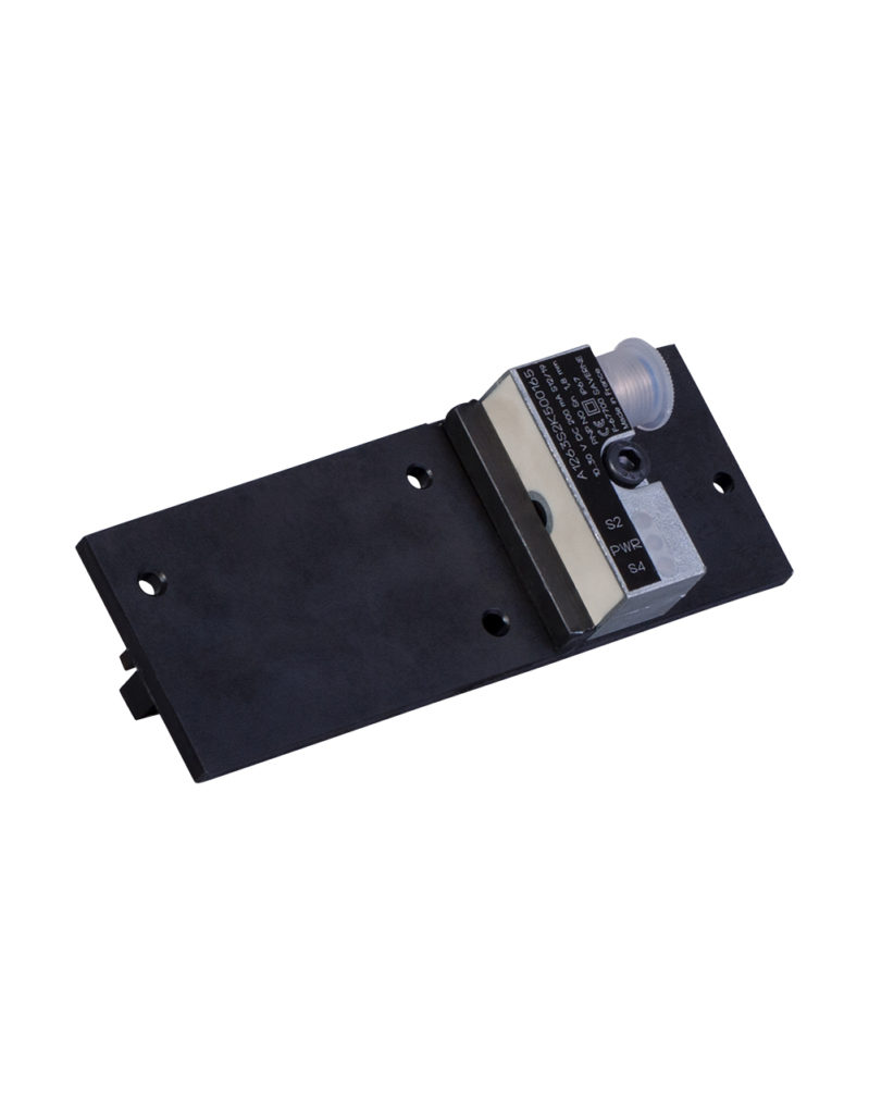 A black plate with a power unit and rotating motor on the right side to be added to a SPXM63 as an accessory