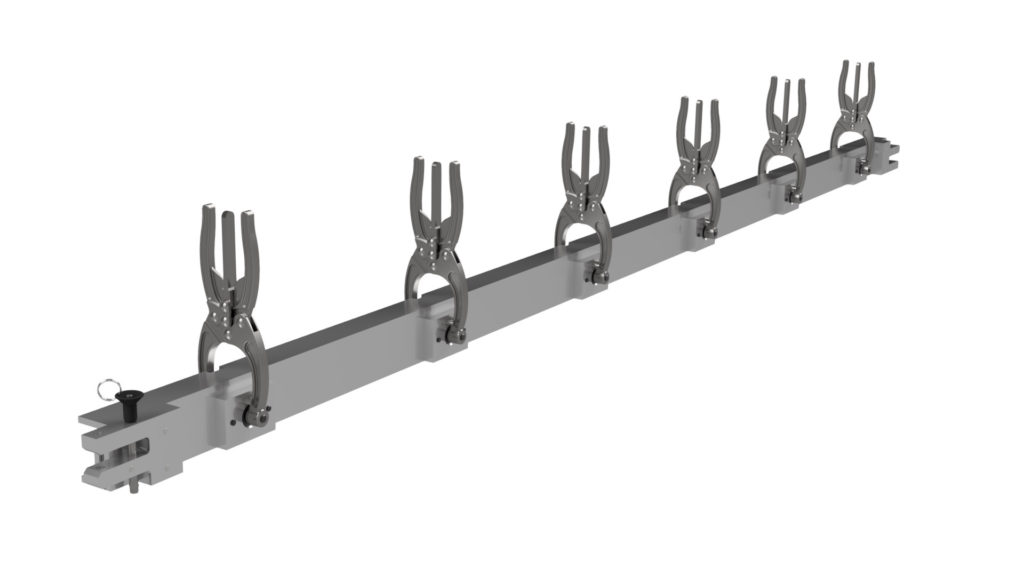 An Engineered steel bar with 6 toggle clamps placed on it, showcasing Sandfield Engineering's bespoke engineering